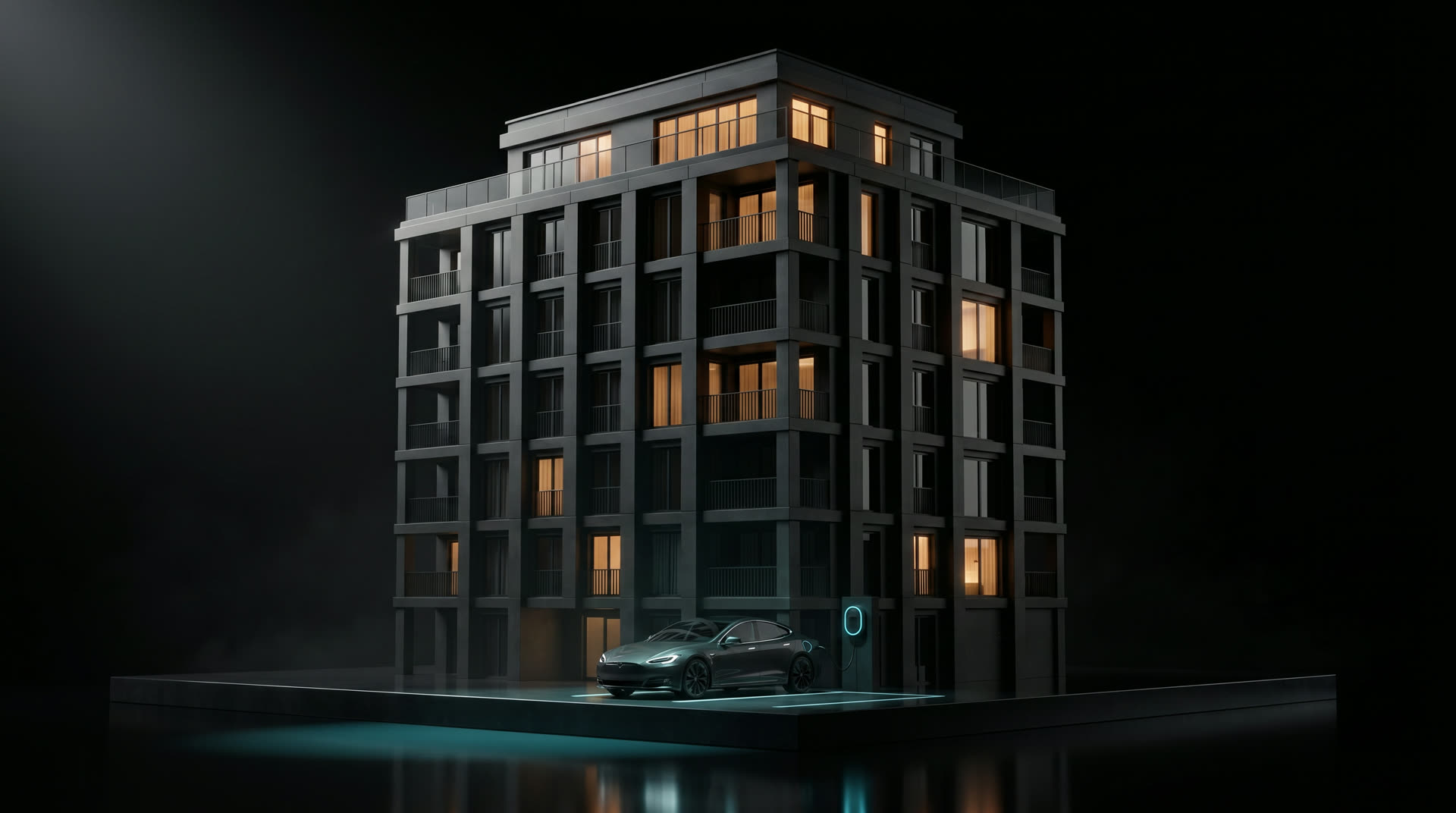Elektroauto an einer Wallbox vor einem Mehrfamilienhaus bei Nacht